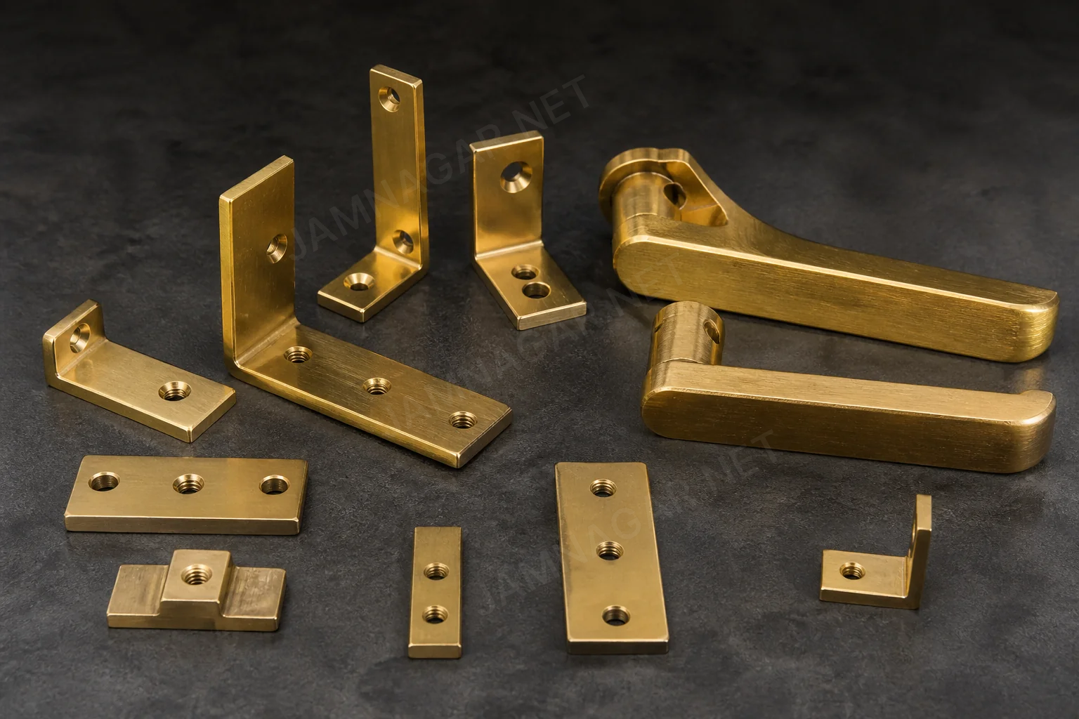 Brass hinge and handle hardware parts arranged for finish matching